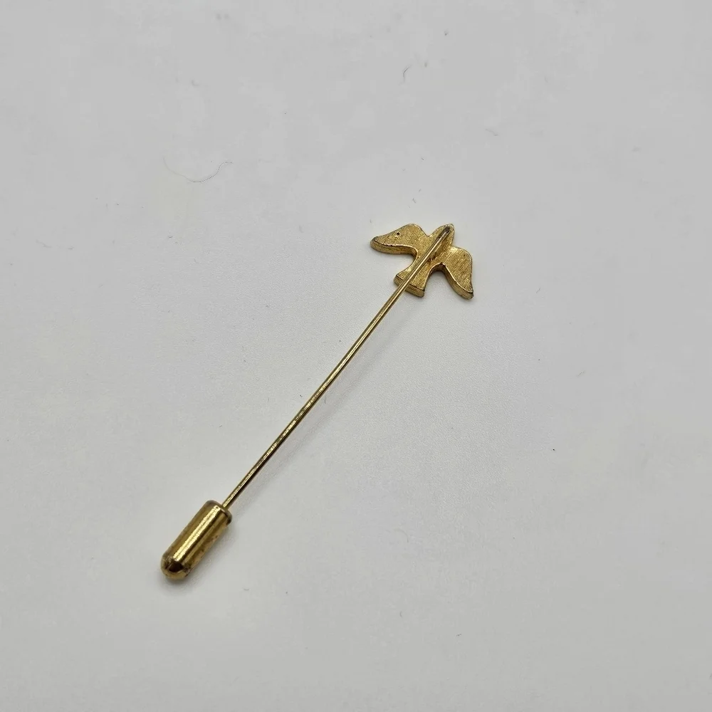 gold tone stick pin with dove